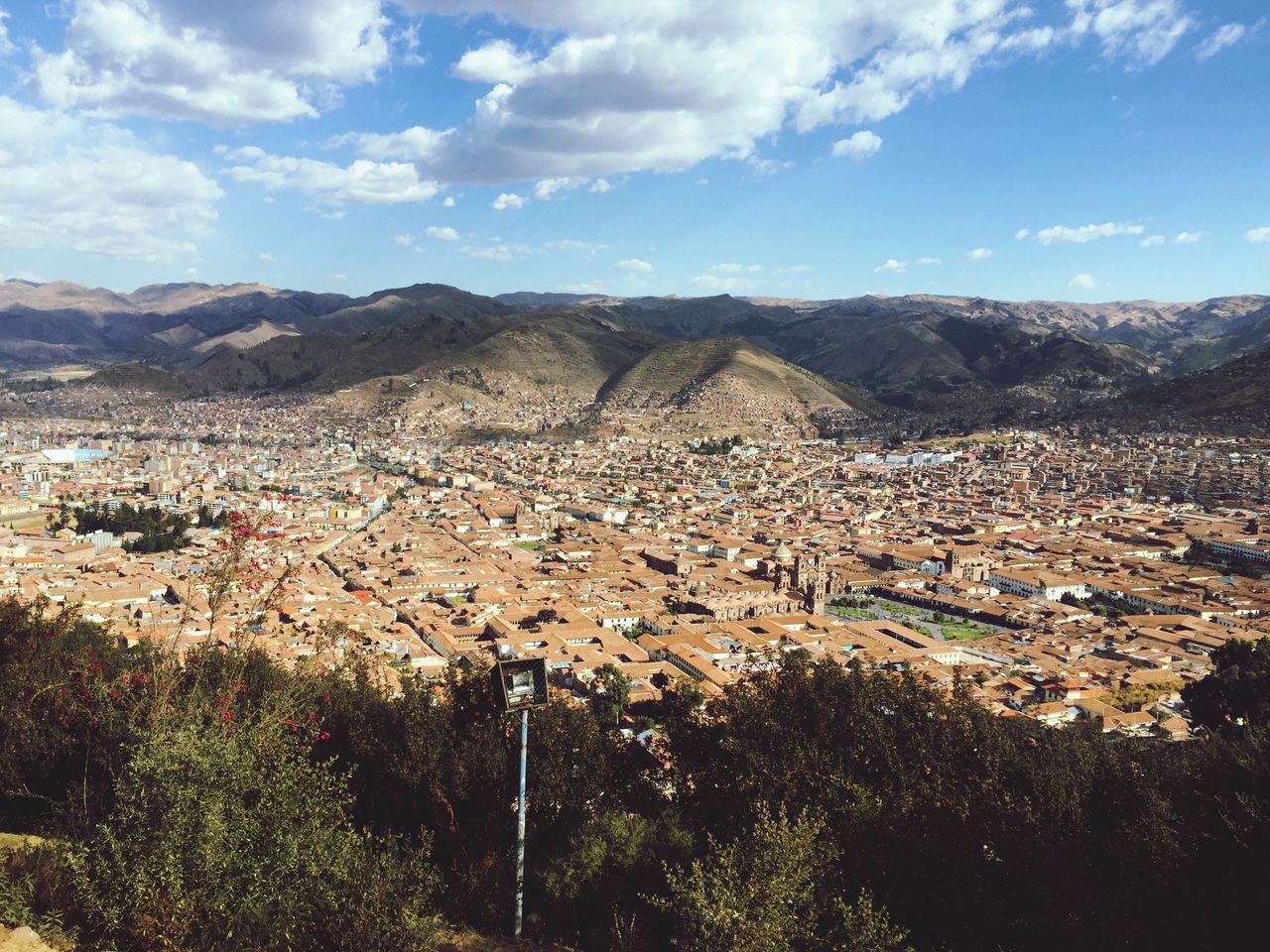 mountain, sky, landscape, mountain range, cloud - sky, high angle view, beauty in nature, scenics, nature, building exterior, cloud, cityscape, tranquil scene, built structure, tranquility, residential district, city, outdoors, blue, architecture