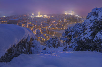 High angle view of snow covered buildings against sky