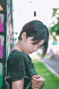 Portrait of a young woman looking down