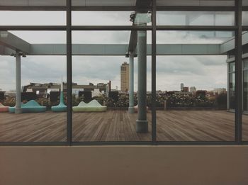 View of modern buildings against cloudy sky