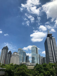 Buildings in city against sky