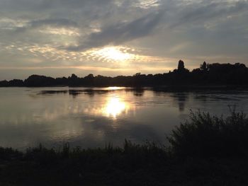 View of calm lake at sunset