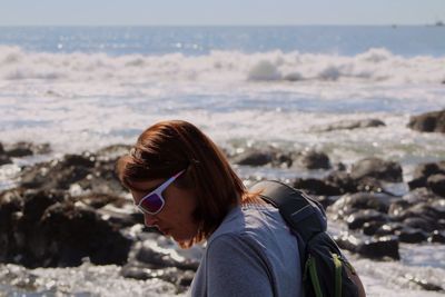 Woman at beach during sunny day