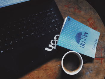 High angle view of coffee cup on table