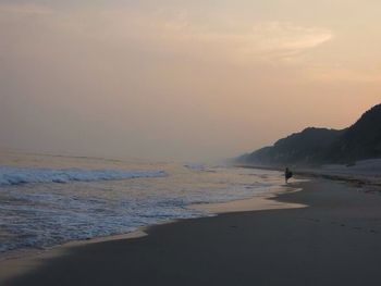 Scenic view of sea at sunset