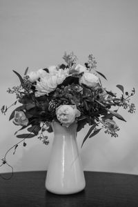 Close-up of white flower vase on table