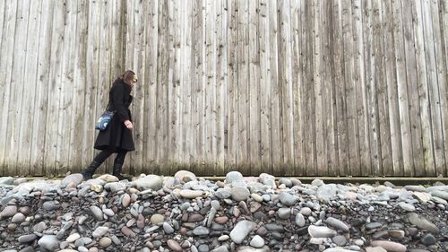 Woman standing on rock