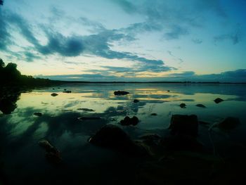 Scenic view of lake against sky during sunset