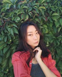 Portrait of beautiful young woman looking away