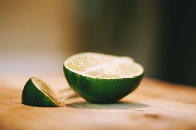 Close-up of lime slices on table