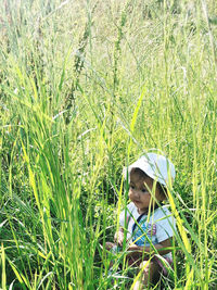 Portrait of girl on grassy field