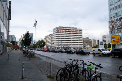 City street and buildings against sky