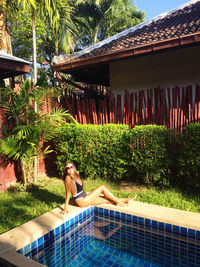 Woman relaxing in swimming pool