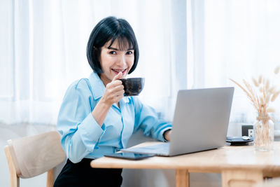 Young businesswoman working in office