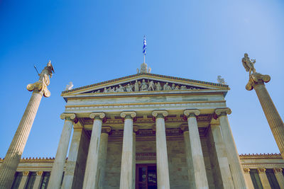 Low angle view of historical building against blue sky