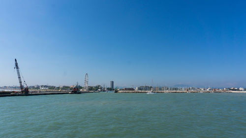 Scenic view of sea against clear blue sky