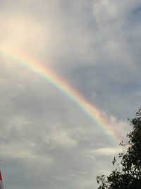 Low angle view of rainbow against sky