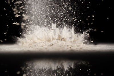 Close-up of splashing water against black background