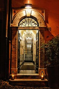 Illuminated entrance of historic building