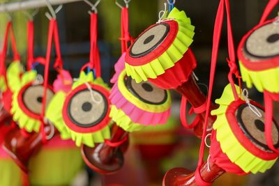 Close-up of multi colored flags hanging at market stall