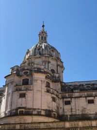 Low angle view of building against clear blue sky