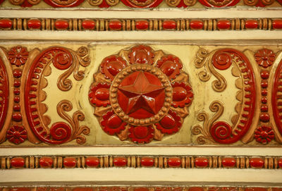 Directly below shot of ornate design on wall