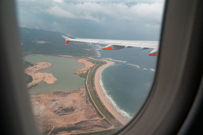 Aerial view of landscape seen through airplane window