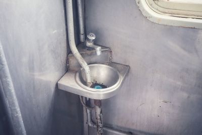 High angle view of water pipe on wall