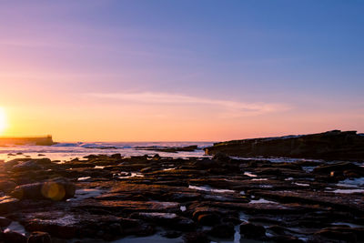 Scenic view of sea against sky during sunset