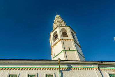 Low angle view of building against clear blue sky