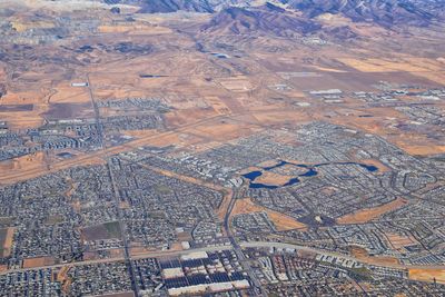 Daybreak lake oquirrh mountains aerial, copper mine, rocky mountains from airplane herriman utah usa