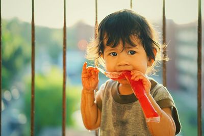 Portrait of cute boy eating food