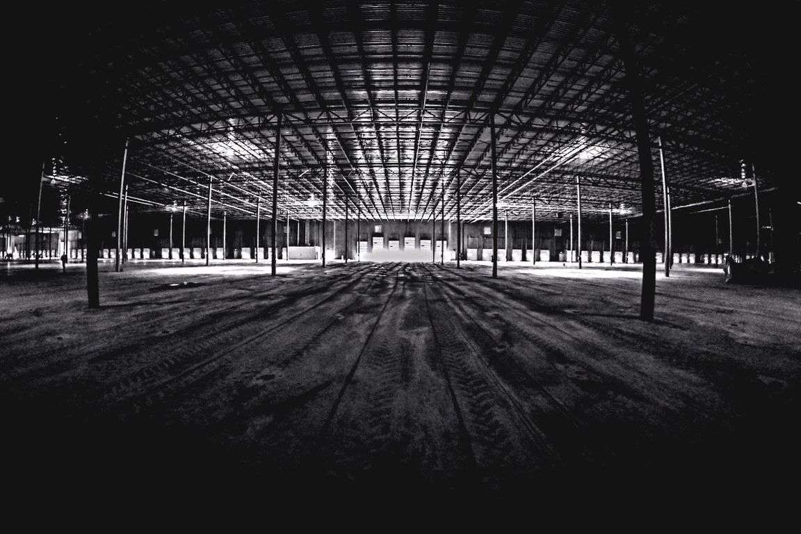 indoors, architecture, built structure, ceiling, the way forward, empty, abandoned, diminishing perspective, interior, absence, wood - material, architectural column, no people, in a row, old, day, obsolete, damaged, vanishing point, flooring