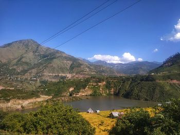 Scenic view of landscape and mountains against sky