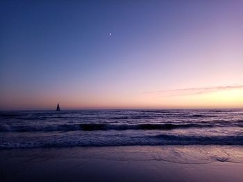 Scenic view of sea against sky at sunset