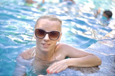 Portrait of woman swimming in pool