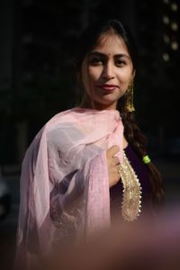 Portrait of young woman standing in temple