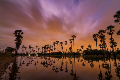 Scenic view of lake against sky during sunset