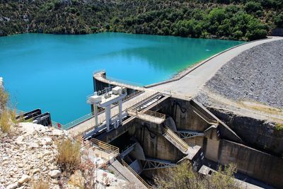 High angle view of dam amidst trees