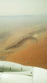 Scenic view of beach against sky during sunset
