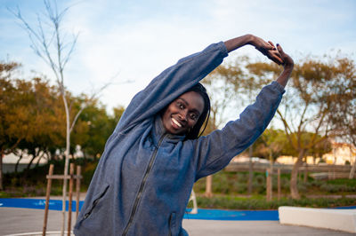 Portrait of a smiling young man standing outdoors