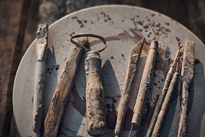 High angle view of metallic tools on table