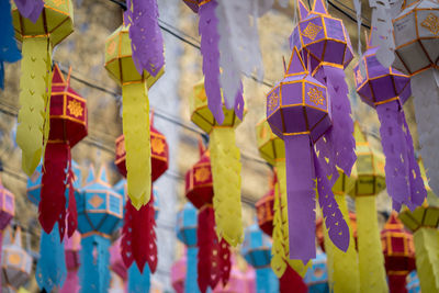 Low angle view of decorations hanging in row