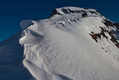 Snow covered mountain against sky