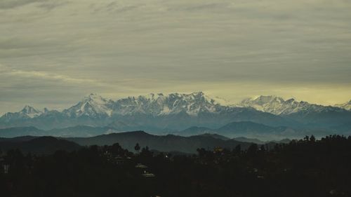 Scenic view of mountains against sky during sunset