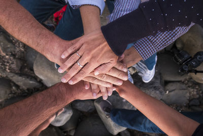 Close-up of friends stacking hands