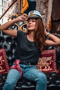 Portrait of beautiful woman sitting in traditional clothing