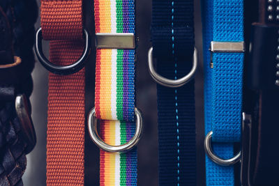 Close-up of colorful belts for sale