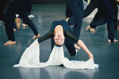 Young woman dancing on floor