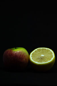 Close-up of apple against black background